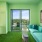 a clubhouse room with green furniture