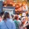 a group of people at a food stand