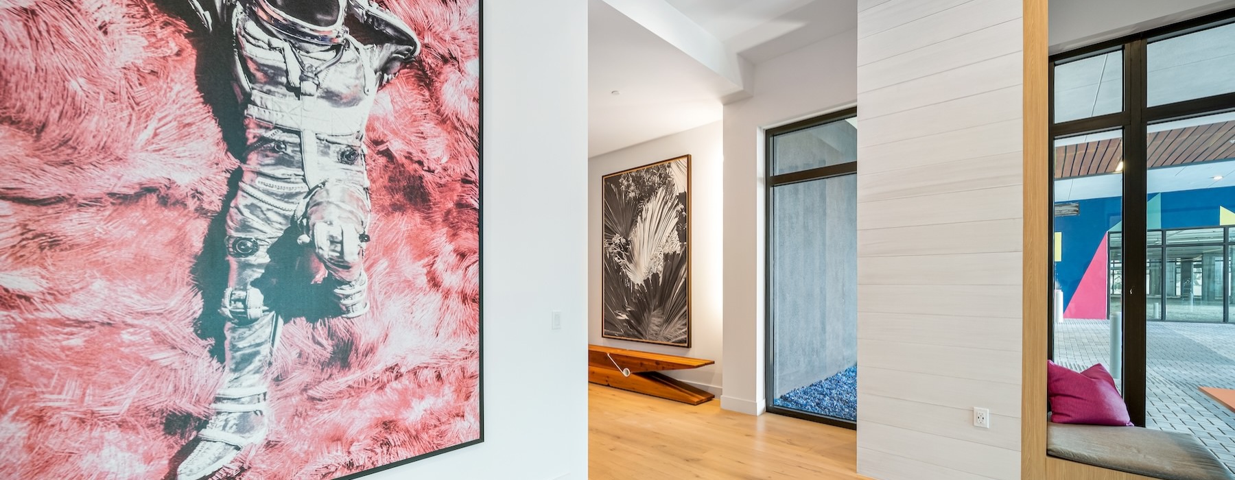 a clubhouse room with a large painting on the wall
