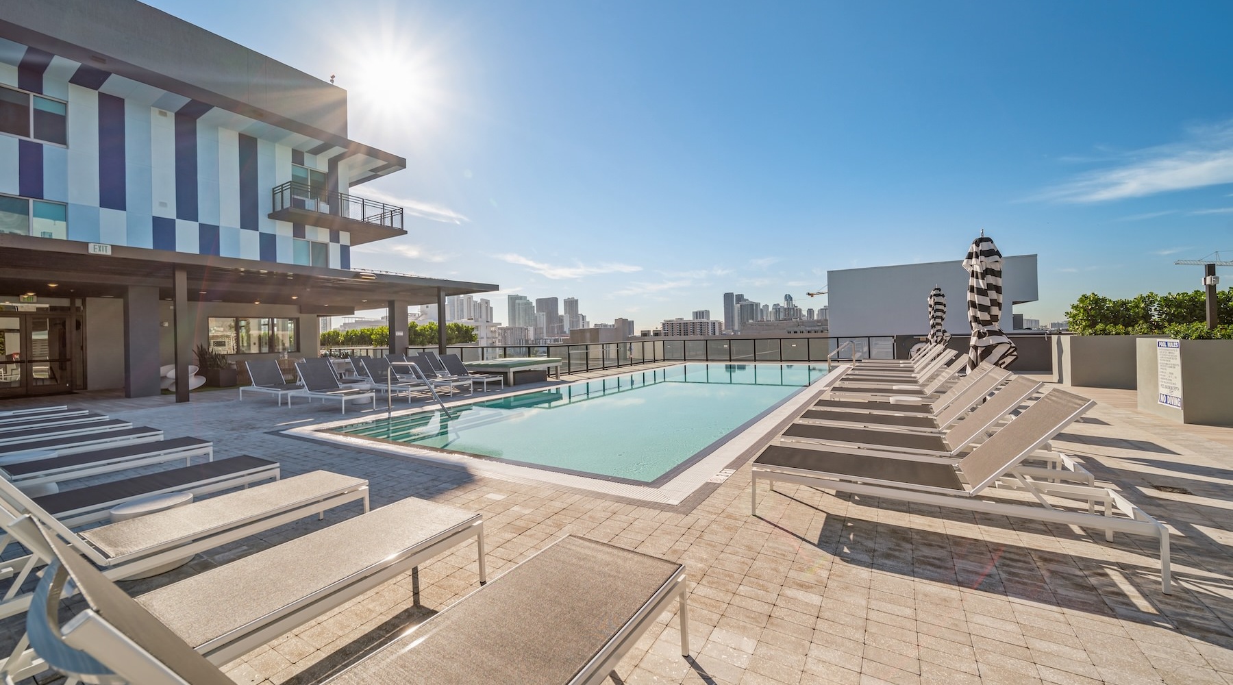 Resort-style swimming pool a swimming pool in front of a building