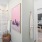 a bathroom with a pink and white shower curtain