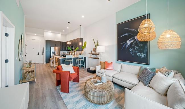 Beautiful living areas to match your lifestyle a living room with a chandelier and a couch