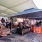 a group of people sitting under a tent at a restaurant