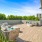 a deck with couches and trees