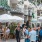 a bunch of people eating outside of a restaurant