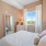 a bedroom with a bed and a mirror