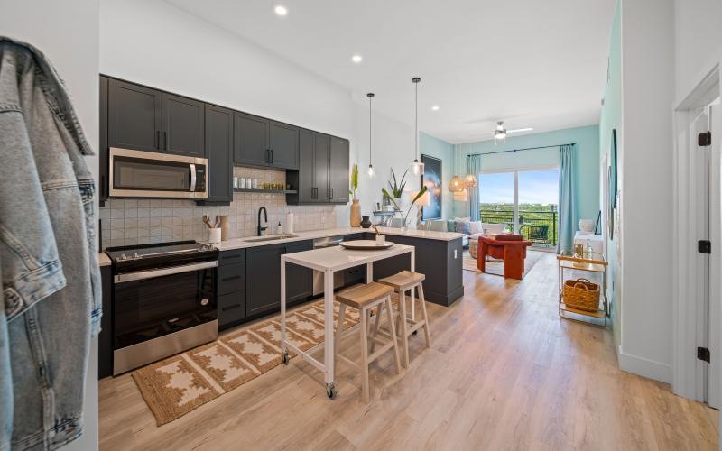 a kitchen with black cabinets