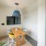 a clubhouse office with a tv, table and chairs