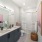 a bathroom with a tub sink and toilet