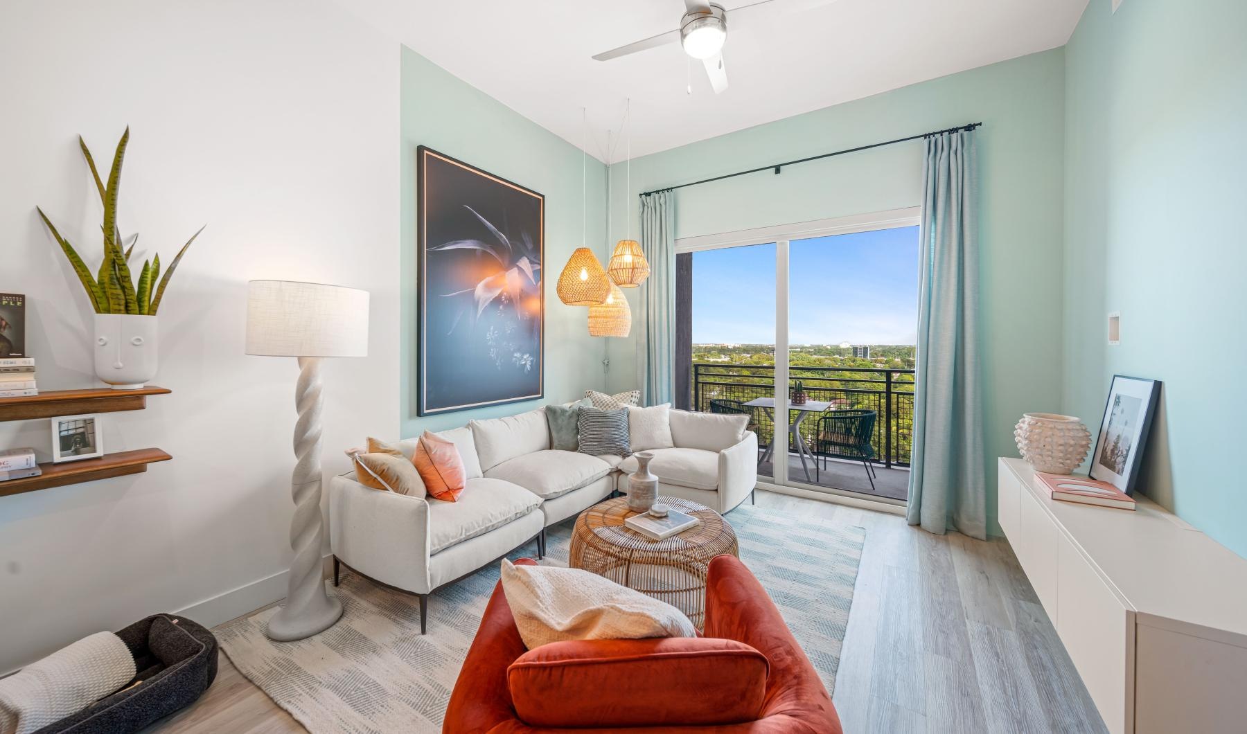 Wide open living areas perfect for entertaining a living room with a chair, couch and a large window