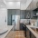 a kitchen with a tub sink and cabinets